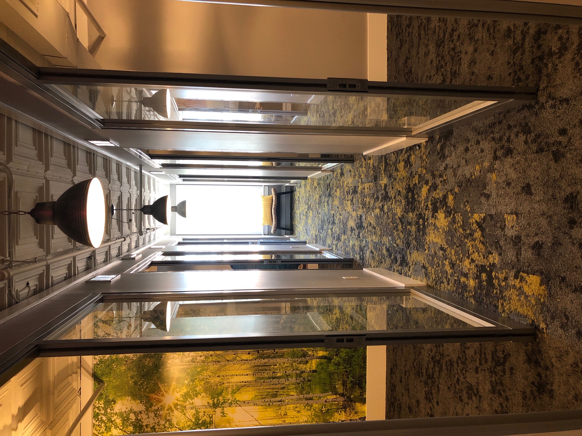 Corridor co-working space with long hallway and glass doors