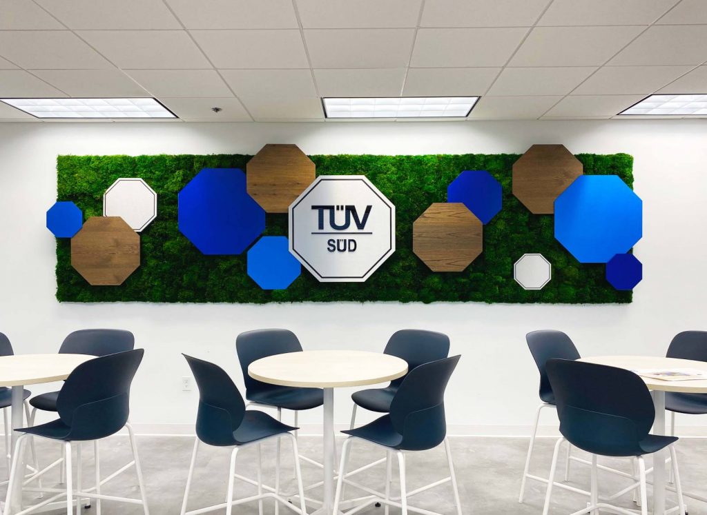 Round tables and bar style seating for trade and development break area