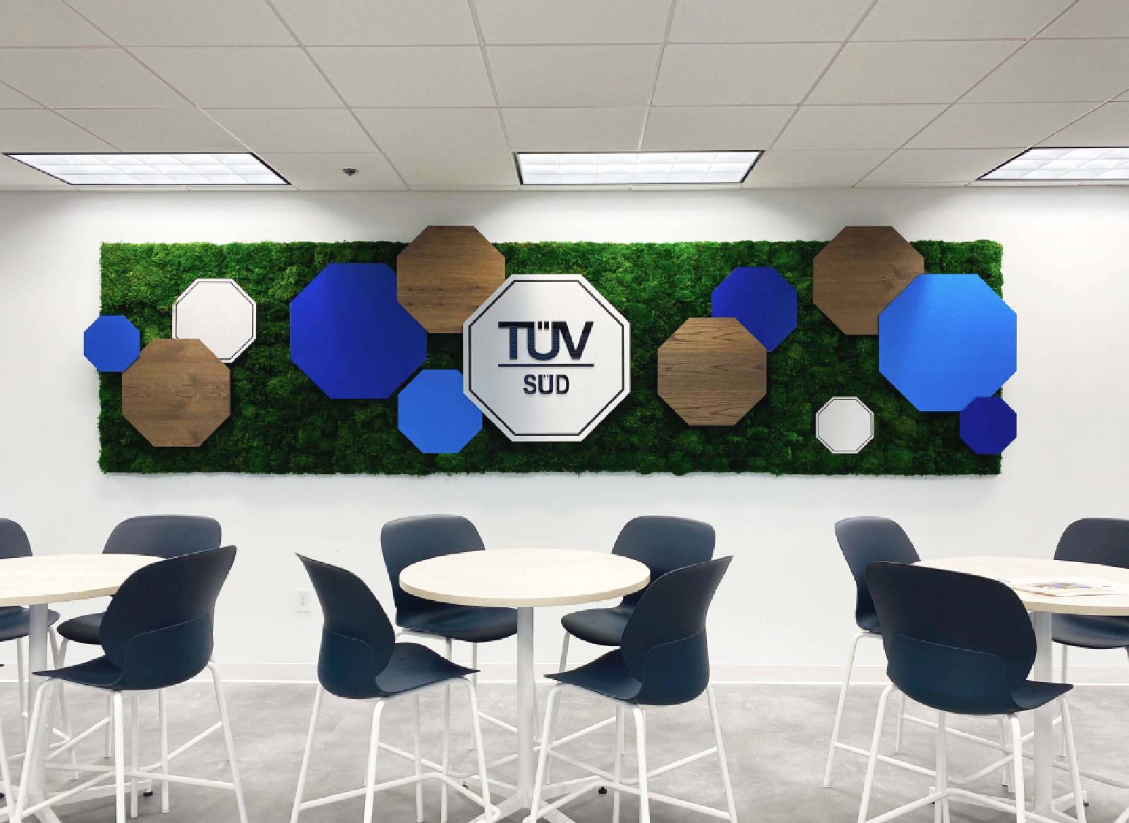 Biophilic Installation for work area on wall behind round table and chairs