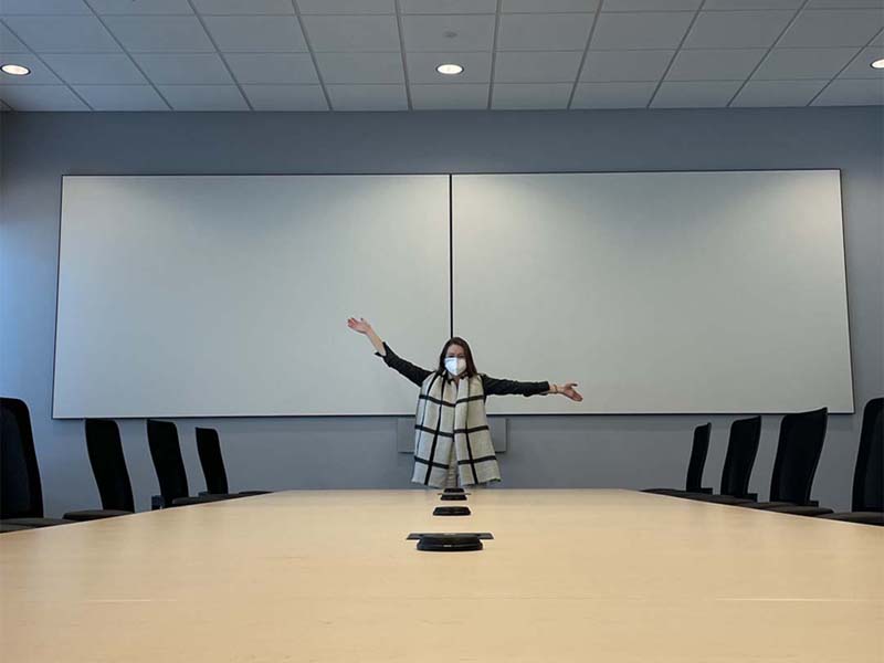 Ellen in new office conference room for corporate office