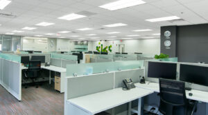 Modern work area with plexiglass above each desk area