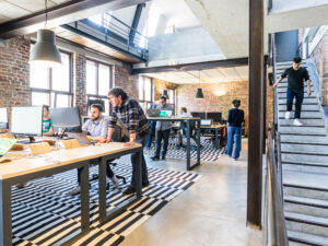 Modern office design with desk and different levels and standing desk areas