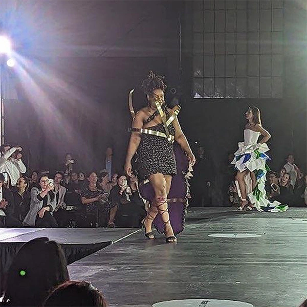Fashionable models walking with designs from HF Planners
