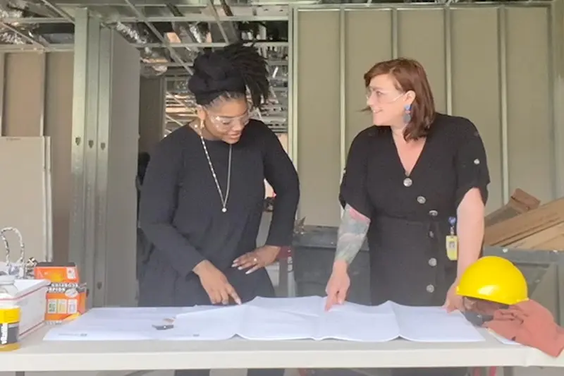 Facility management construction supervisor with client