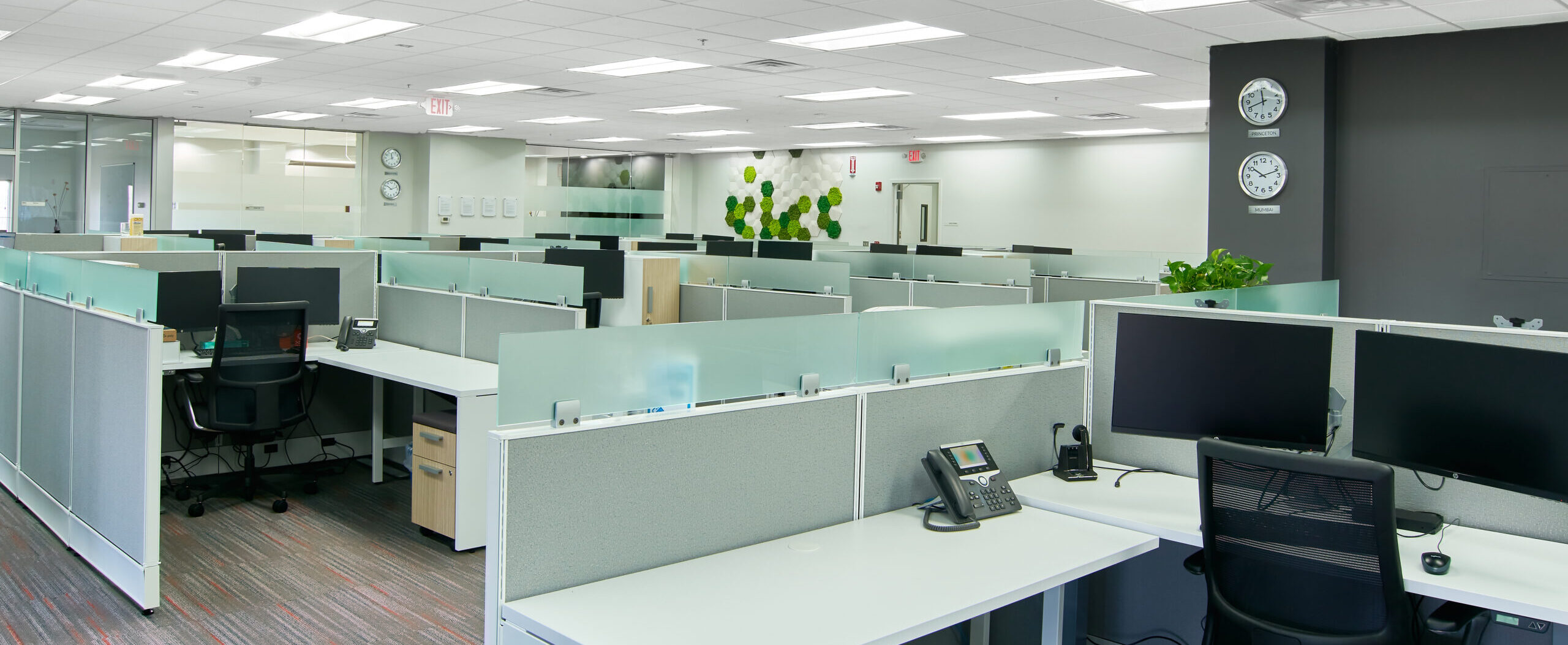 Indoor corporate office space interior design with multiple workspaces
